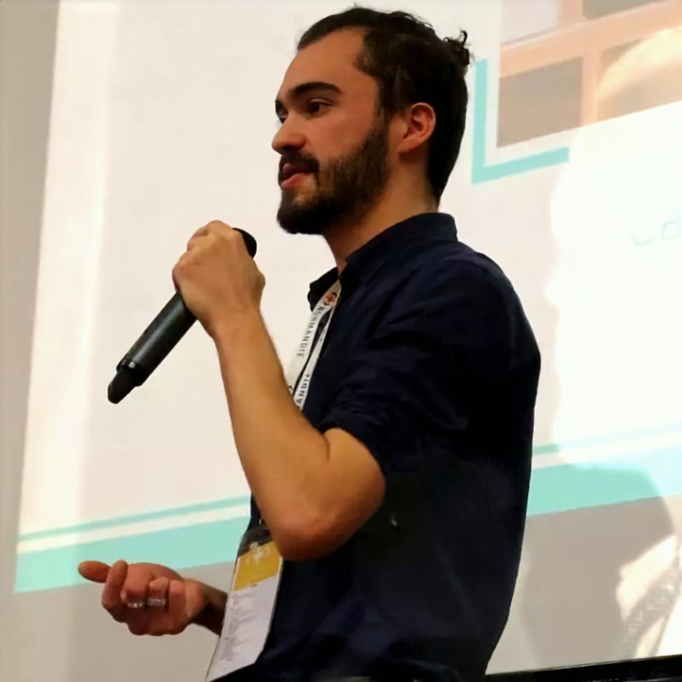 Simon Heilles speaking at a conference
